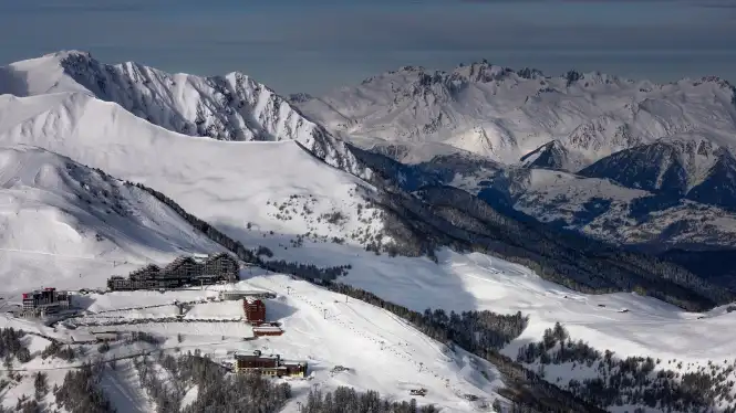 La Plagne's Aime 2000 iconic Paquebot building surrounded by blue pistes