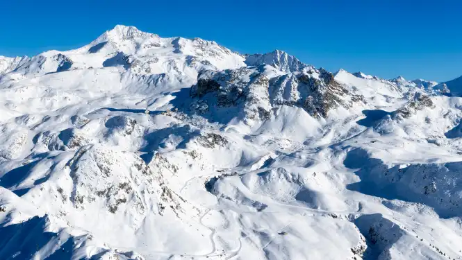 View over La Plagne and the Bellecôte glacier showing some of the best blue piste terrain