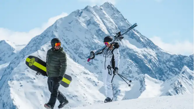 two beginner skiers and snowboarders in La Plagne