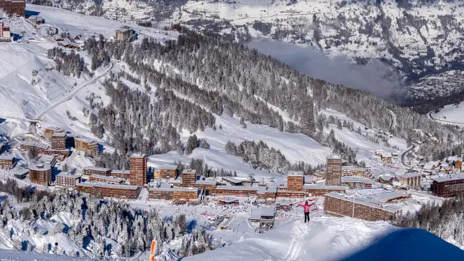 Skier on blue pistes above Plagne Centre