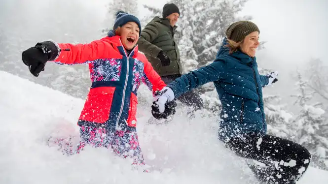 A travel guide to get to La Plagne with an image showing a happy family in the resort