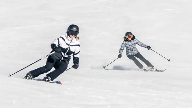 Skiers on piste in La Plagne